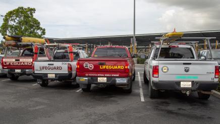 Lifeguard trucks in parking lot